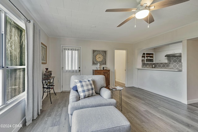 2406 Sewanee St, Lynn Haven, FL 32444 - sitting room featuring baseboards, wood finished floors, a ceiling fan, and ornamental molding