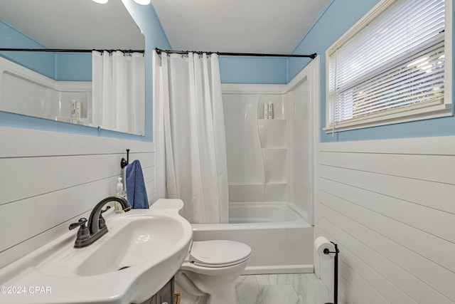 full bathroom with toilet, sink, and shower / tub combo with curtain