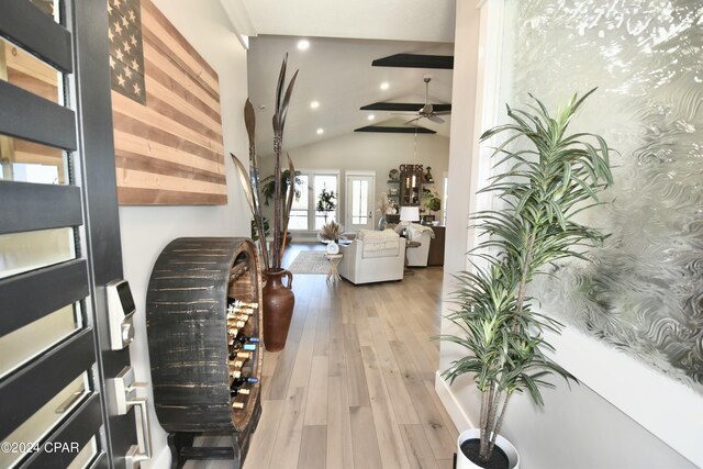 interior space featuring vaulted ceiling with beams and wood-type flooring