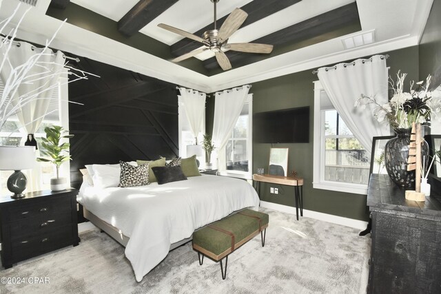 bedroom featuring ceiling fan, beamed ceiling, and carpet floors