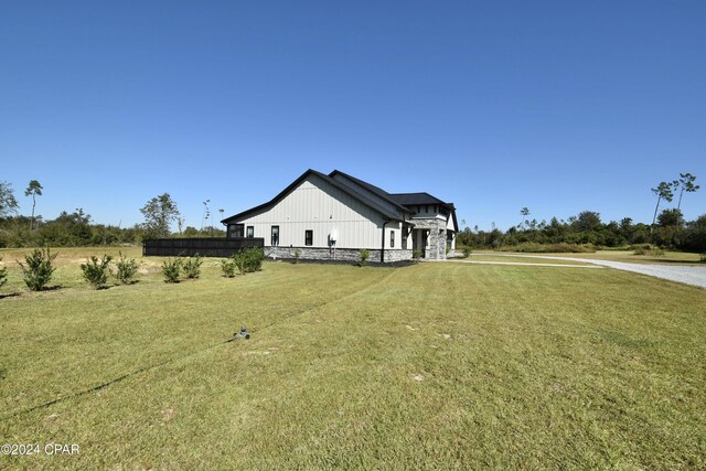 view of property exterior with a yard