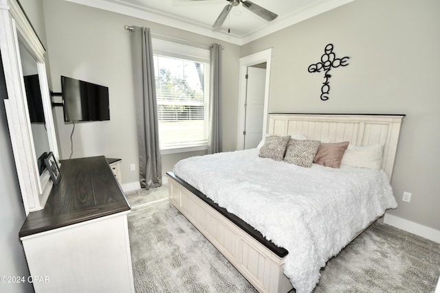 bedroom with ceiling fan, crown molding, and light carpet