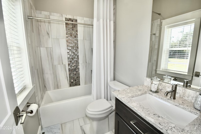 full bathroom with shower / tub combo, vanity, and toilet