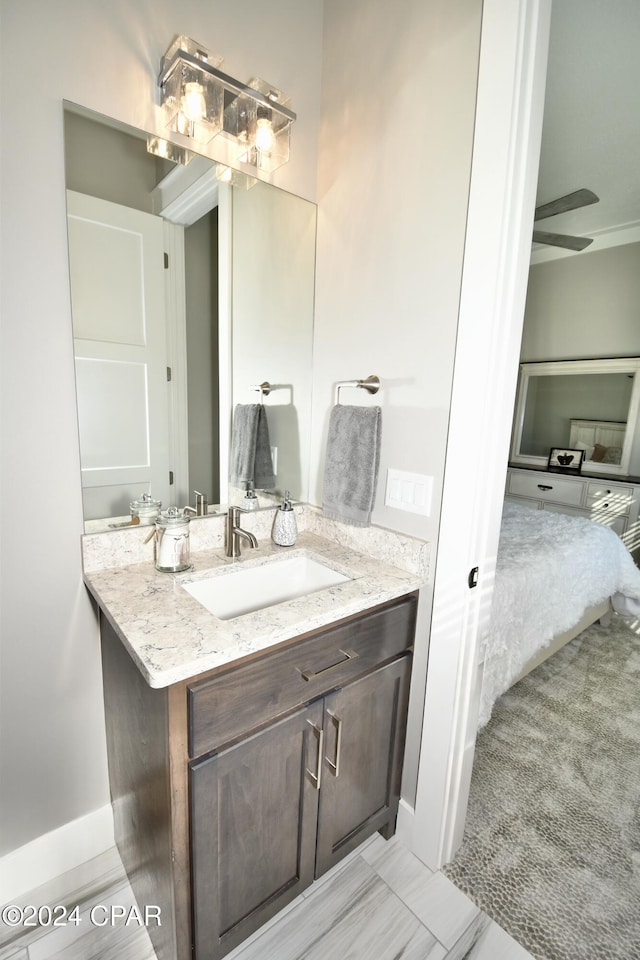 bathroom featuring vanity and ceiling fan