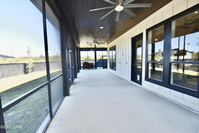 sunroom featuring wooden ceiling