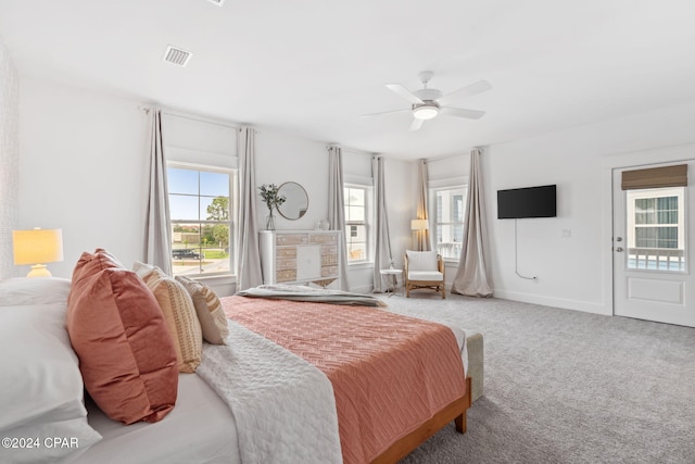 bedroom featuring carpet flooring, access to exterior, and ceiling fan