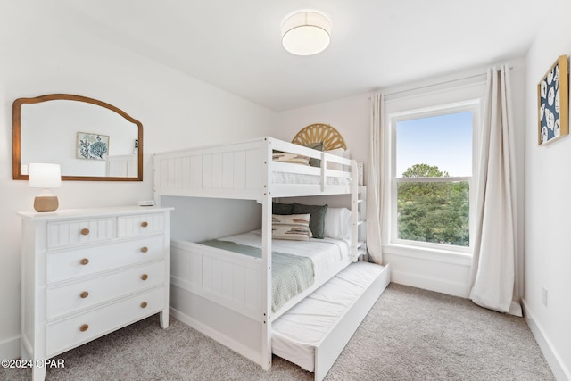 bedroom with light colored carpet