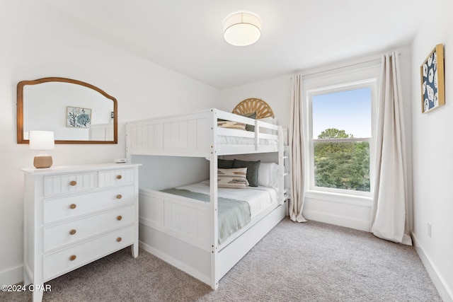 unfurnished bedroom featuring light colored carpet