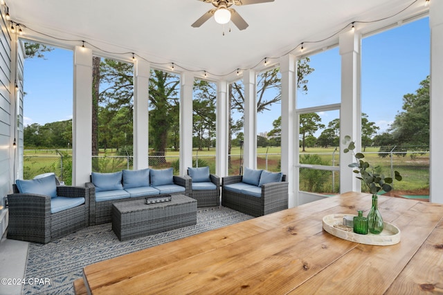 sunroom featuring a wealth of natural light and ceiling fan