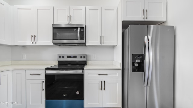 kitchen featuring white cabinetry and stainless steel appliances