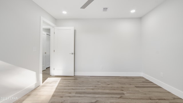 unfurnished room featuring ceiling fan and light hardwood / wood-style flooring