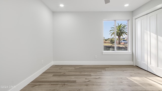 spare room with light wood-type flooring