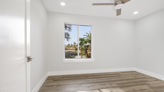 empty room featuring ceiling fan and light wood-type flooring