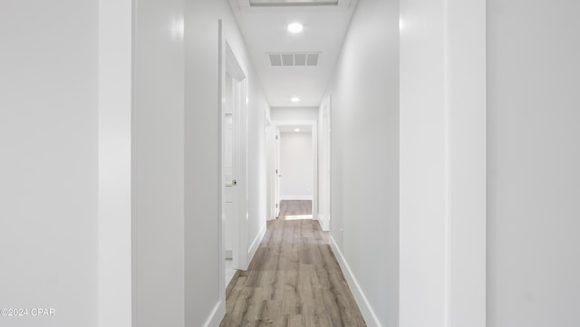 corridor with light wood-type flooring