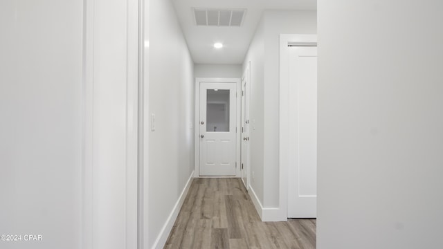 corridor featuring light wood-type flooring