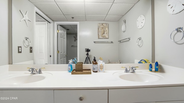 bathroom with vanity and a paneled ceiling