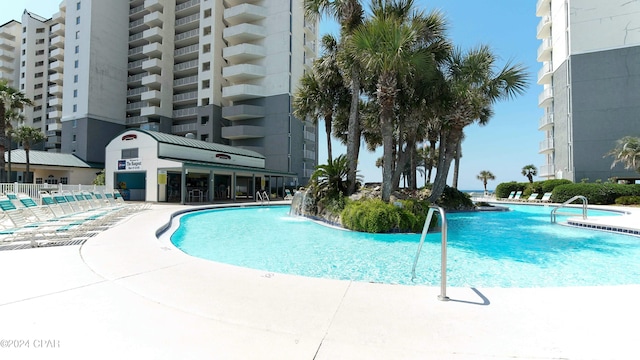 view of swimming pool featuring pool water feature