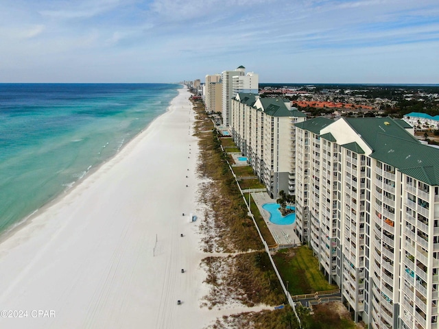 birds eye view of property with a view of the beach and a water view