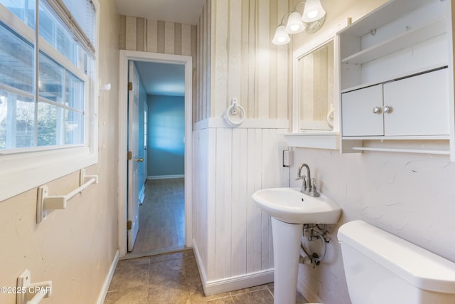 bathroom with tile patterned floors and toilet