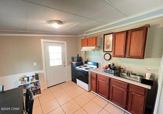 kitchen with sink, electric range, and light tile patterned floors