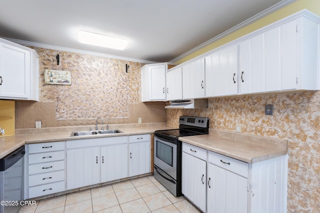 kitchen featuring sink, exhaust hood, white cabinets, and appliances with stainless steel finishes