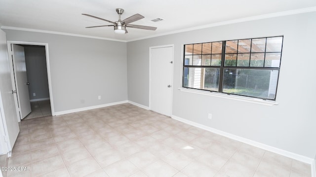 unfurnished room featuring baseboards, visible vents, ceiling fan, and ornamental molding