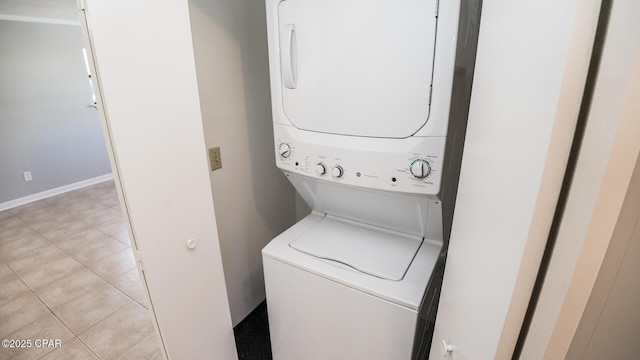 clothes washing area with laundry area and stacked washer and clothes dryer