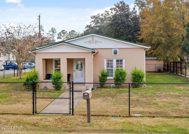 view of front facade with a front lawn and a porch