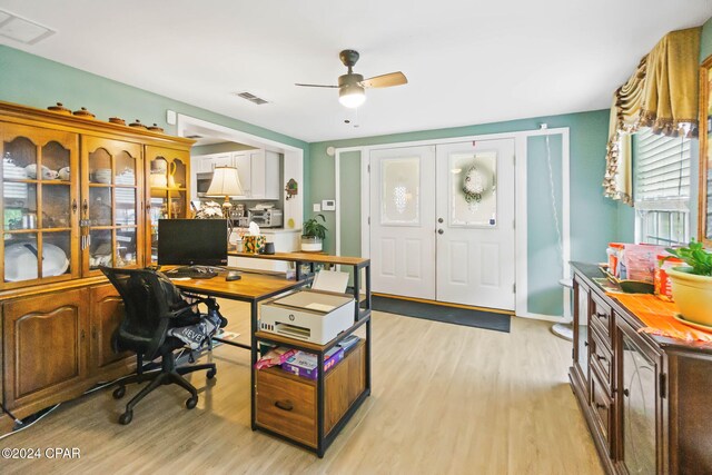 office featuring ceiling fan and light hardwood / wood-style floors