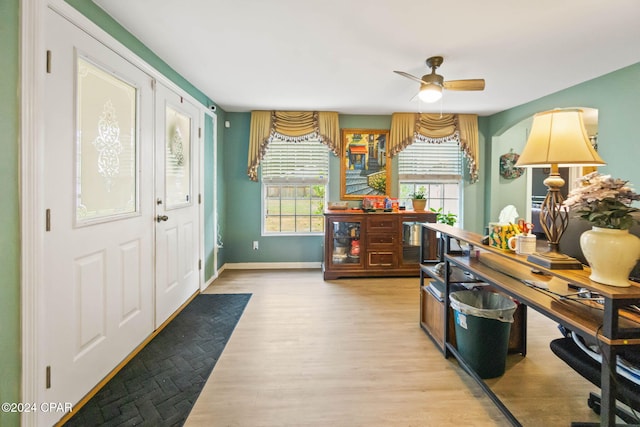 office space featuring light hardwood / wood-style floors and ceiling fan