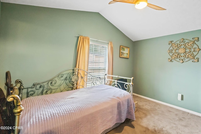 carpeted bedroom featuring vaulted ceiling and ceiling fan