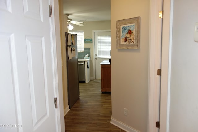 hallway with dark wood-type flooring