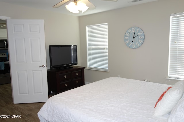 bedroom featuring dark hardwood / wood-style flooring and ceiling fan