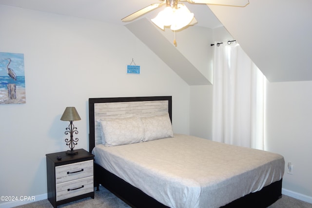 carpeted bedroom with ceiling fan and lofted ceiling