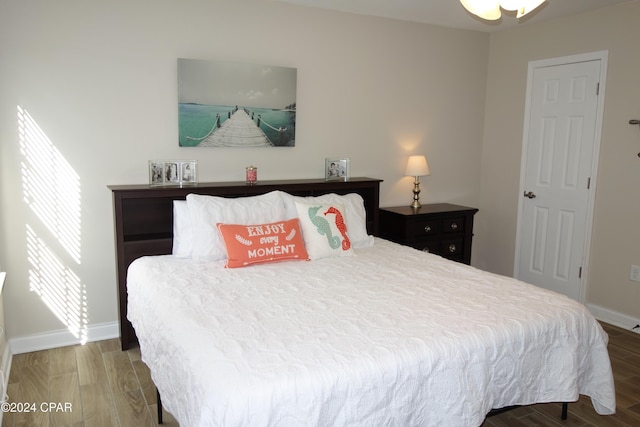 bedroom with wood-type flooring