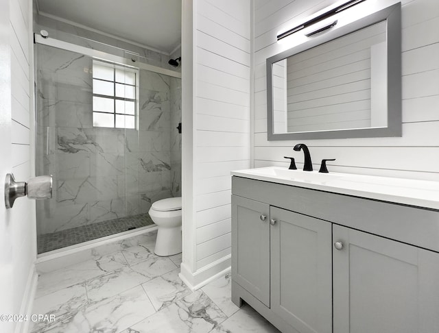 bathroom with wood walls, vanity, an enclosed shower, and toilet