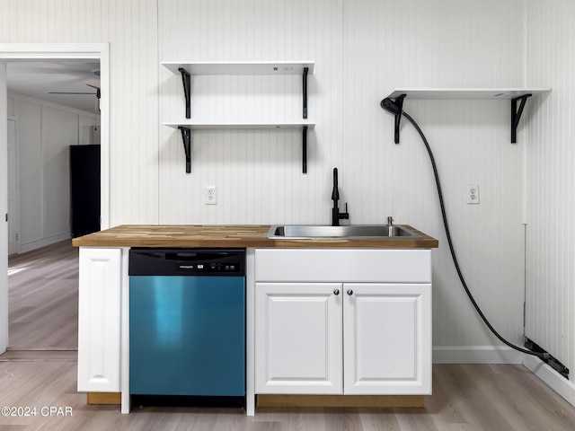 kitchen featuring sink, stainless steel dishwasher, ceiling fan, light hardwood / wood-style floors, and white cabinetry