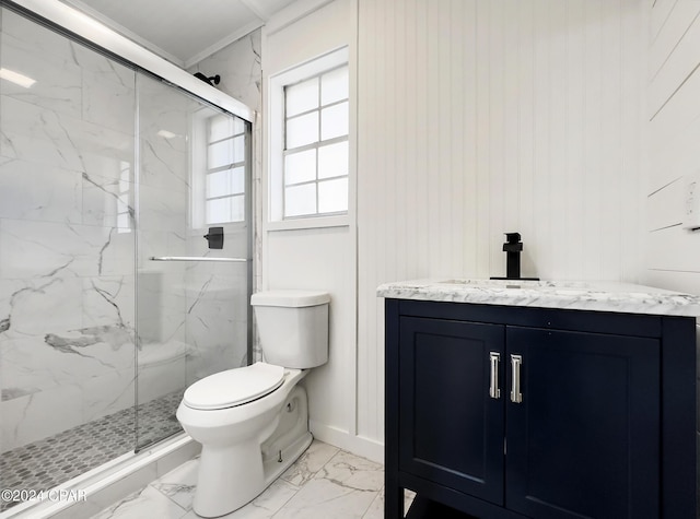 bathroom featuring vanity, wooden walls, toilet, ornamental molding, and a shower with shower door