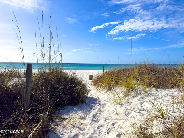 property view of water featuring a beach view