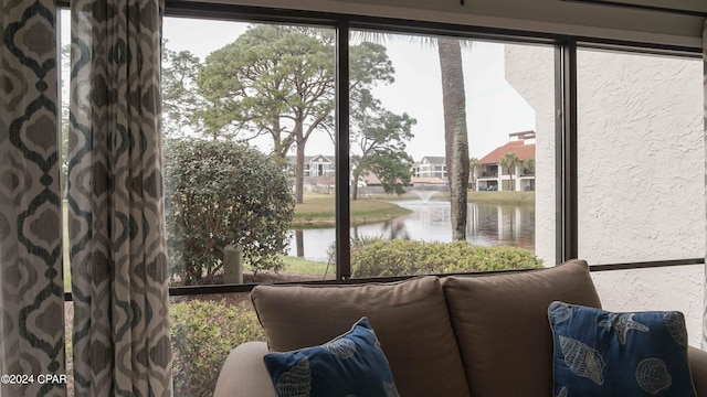 interior space with a water view and a wealth of natural light