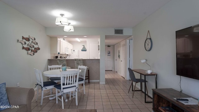 dining space with light tile patterned flooring