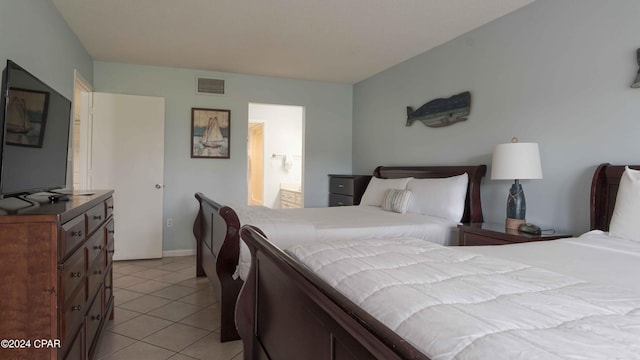 tiled bedroom with connected bathroom