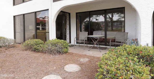 property entrance with a patio