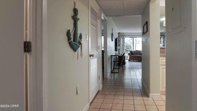 corridor featuring light tile patterned floors