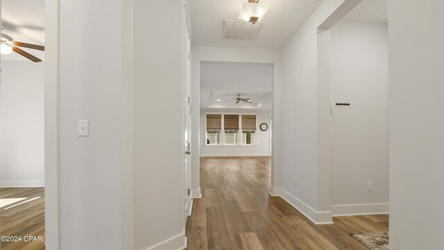 corridor featuring wood-type flooring