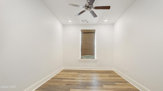 spare room featuring ceiling fan and light wood-type flooring