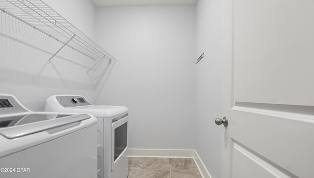 laundry room with washing machine and clothes dryer