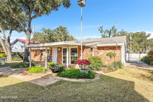 ranch-style house with a front yard