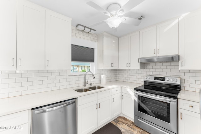 kitchen featuring white cabinetry, sink, tasteful backsplash, and appliances with stainless steel finishes