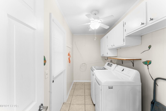 washroom with light tile patterned floors, crown molding, ceiling fan, cabinets, and washer and dryer